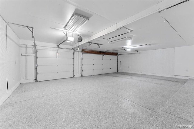 10161 N Loma Cir, Grosse Ile, MI 48138 - garage featuring a garage door opener