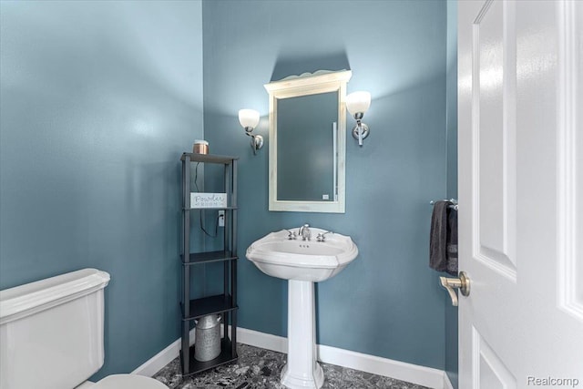 10161 N Loma Cir, Grosse Ile, MI 48138 - bathroom with baseboards and toilet