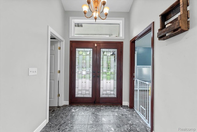 10161 N Loma Cir, Grosse Ile, MI 48138 - entrance foyer with a chandelier, healthy amount of natural light, baseboards, and french doors