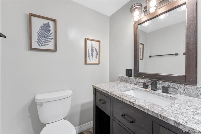 10161 N Loma Cir, Grosse Ile, MI 48138 - half bathroom featuring toilet, vanity, and baseboards