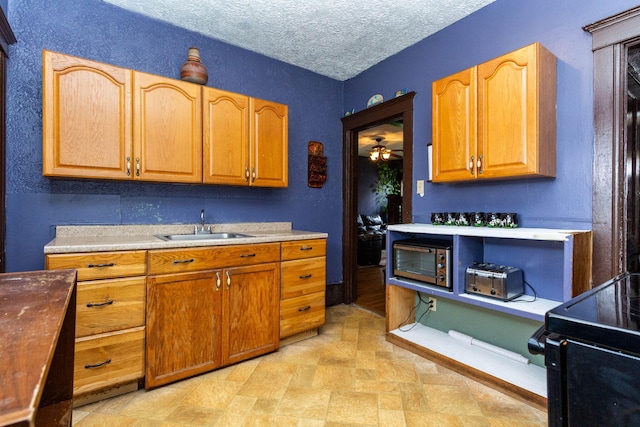 323 Northbound Gratiot Ave, Mount Clemens, MI 48043 - kitchen with a sink, electric range, a textured ceiling, light countertops, and a ceiling fan