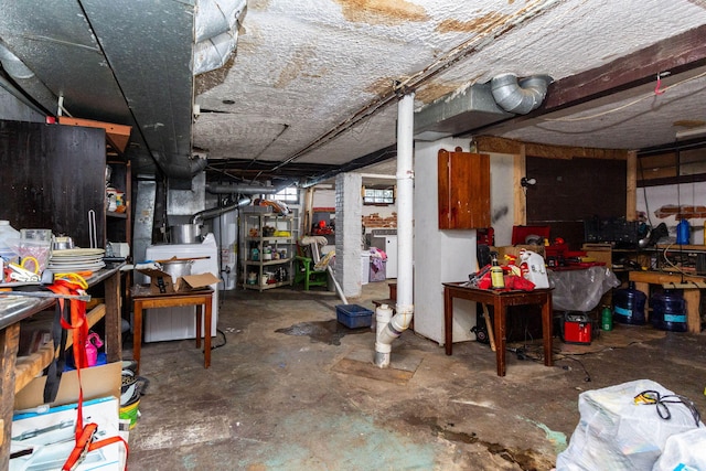 323 Northbound Gratiot Ave, Mount Clemens, MI 48043 - unfinished basement featuring a workshop area and washer / clothes dryer