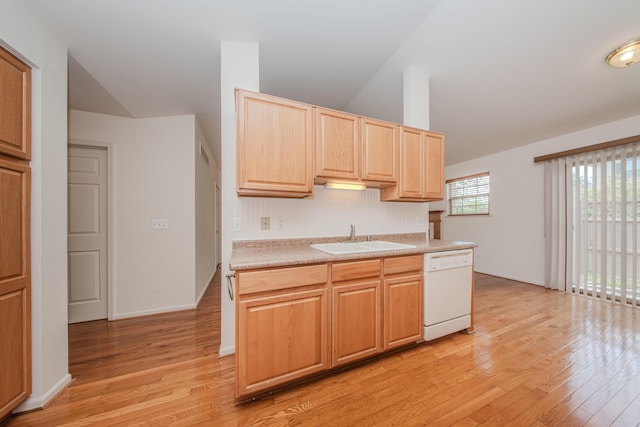 128 Commons Cir, Saline, MI 48176 - kitchen featuring a sink, dishwasher, light brown cabinets, vaulted ceiling, and light wood-style flooring
