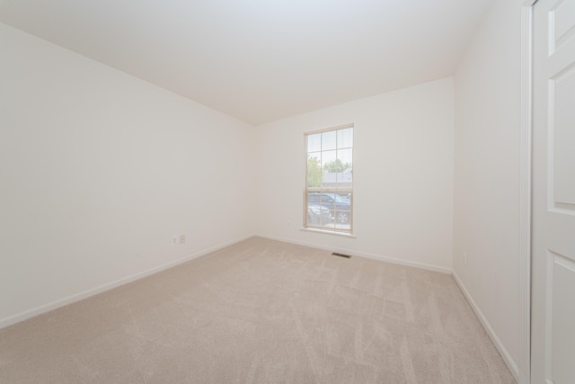 128 Commons Cir, Saline, MI 48176 - empty room with light colored carpet and baseboards