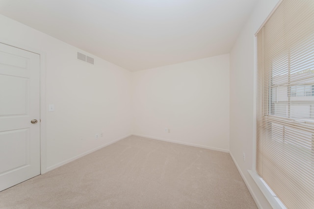 128 Commons Cir, Saline, MI 48176 - empty room with light colored carpet and baseboards