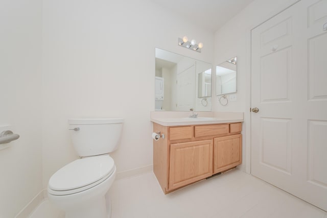 128 Commons Cir, Saline, MI 48176 - half bath with vanity, toilet, baseboards, and tile patterned flooring