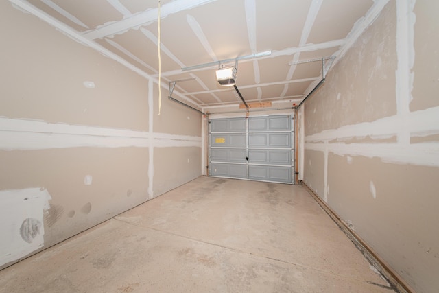 128 Commons Cir, Saline, MI 48176 - garage with a garage door opener