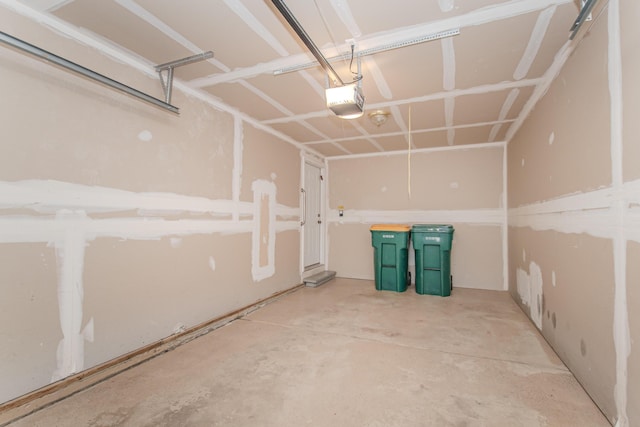 128 Commons Cir, Saline, MI 48176 - garage featuring a garage door opener