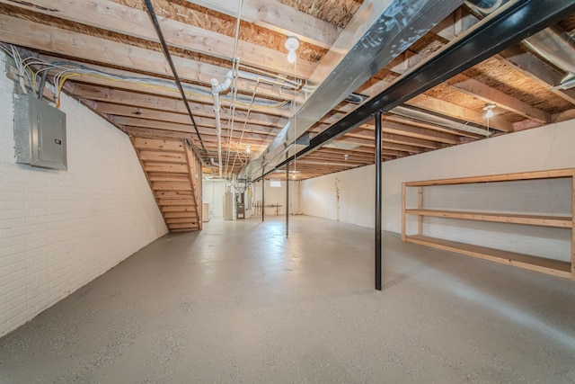 128 Commons Cir, Saline, MI 48176 - unfinished below grade area featuring electric panel and brick wall