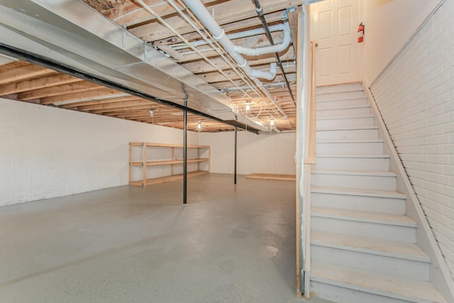 128 Commons Cir, Saline, MI 48176 - unfinished basement featuring stairway