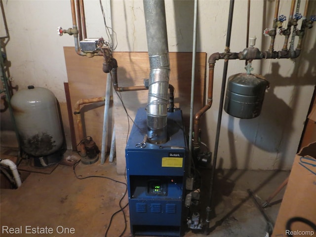 4072 M 55, Cadillac, MI 49601 - utility room with a heating unit