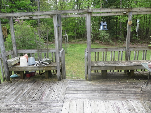 4072 M 55, Cadillac, MI 49601 - wooden terrace with a lawn