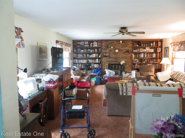 4072 M 55, Cadillac, MI 49601 - living area featuring ceiling fan, carpet floors, built in features, and a brick fireplace