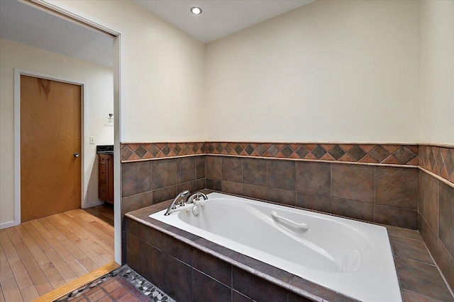 2 Eastbury Ct, Ann Arbor, MI 48105 - bathroom with a garden tub, recessed lighting, and wainscoting