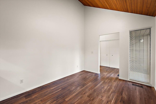 2 Eastbury Ct, Ann Arbor, MI 48105 - unfurnished room featuring vaulted ceiling, a heating unit, dark wood-style floors, baseboards, and wood ceiling