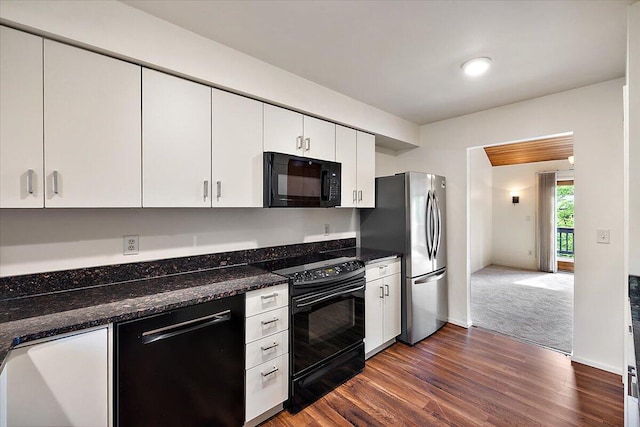 2 Eastbury Ct, Ann Arbor, MI 48105 - kitchen featuring black appliances, white cabinets, dark wood-style flooring, and dark stone counters