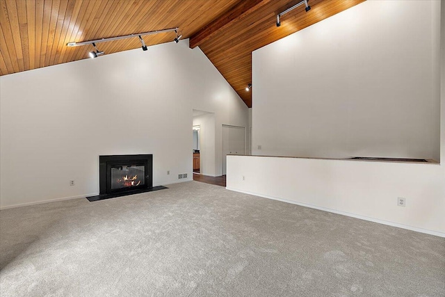 2 Eastbury Ct, Ann Arbor, MI 48105 - unfurnished living room with wooden ceiling with exposed beams, track lighting, carpet, baseboards, and a fireplace with flush hearth