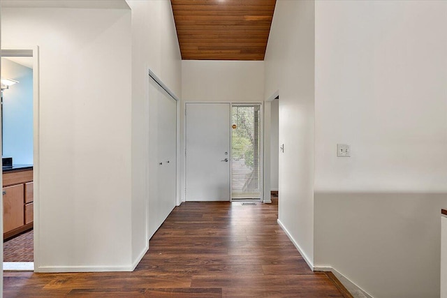 2 Eastbury Ct, Ann Arbor, MI 48105 - foyer entrance with vaulted ceiling, wooden ceiling, dark wood-style flooring, and baseboards
