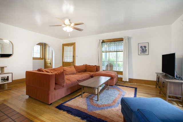3209 Springbrook St, Ann Arbor, MI 48108 - living room with light wood-type flooring, a ceiling fan, baseboards, and arched walkways