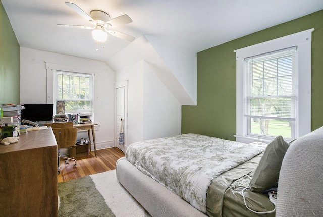 3209 Springbrook St, Ann Arbor, MI 48108 - bedroom with wood finished floors, multiple windows, an office area, and a ceiling fan