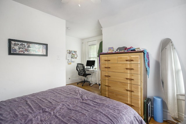 3209 Springbrook St, Ann Arbor, MI 48108 - bedroom with wood finished floors, ceiling fan, an office area, and baseboards