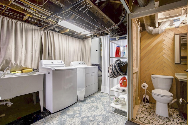3209 Springbrook St, Ann Arbor, MI 48108 - washroom featuring washing machine and clothes dryer and wood walls