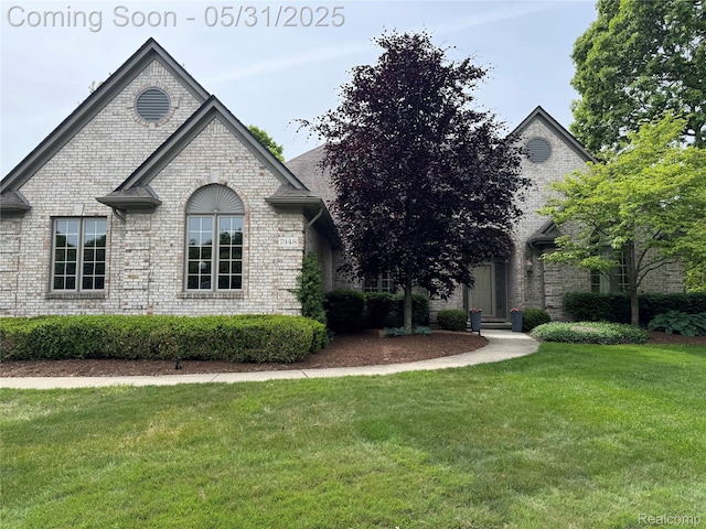 7348 William Dr, Shelby Twp, MI 48316 - view of front of house featuring brick siding and a front yard
