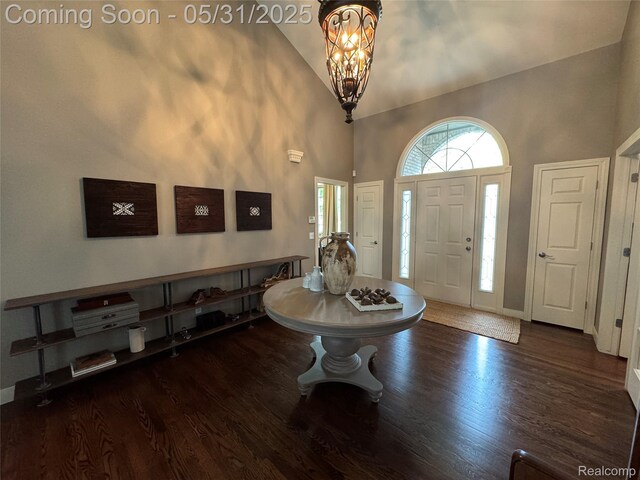 7348 William Dr, Shelby Twp, MI 48316 - entryway with high vaulted ceiling, wood finished floors, baseboards, and a chandelier