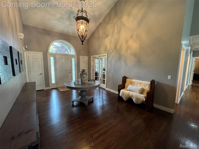 7348 William Dr, Shelby Twp, MI 48316 - entrance foyer with high vaulted ceiling, dark wood finished floors, baseboards, and a chandelier