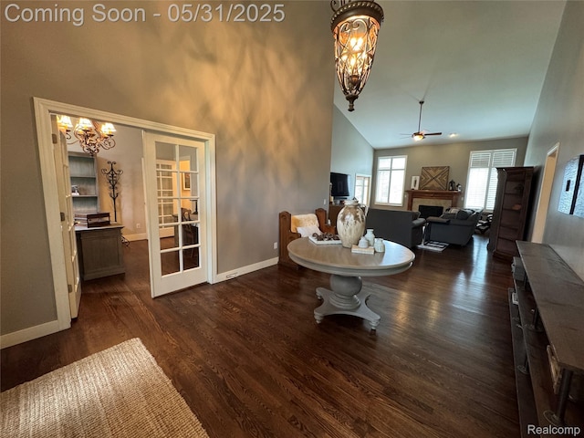 7348 William Dr, Shelby Twp, MI 48316 - living area with high vaulted ceiling, a fireplace, a chandelier, a ceiling fan, and baseboards