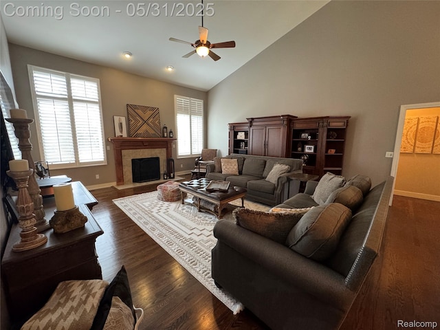 7348 William Dr, Shelby Twp, MI 48316 - living area with ceiling fan, high vaulted ceiling, baseboards, a fireplace with flush hearth, and dark wood finished floors