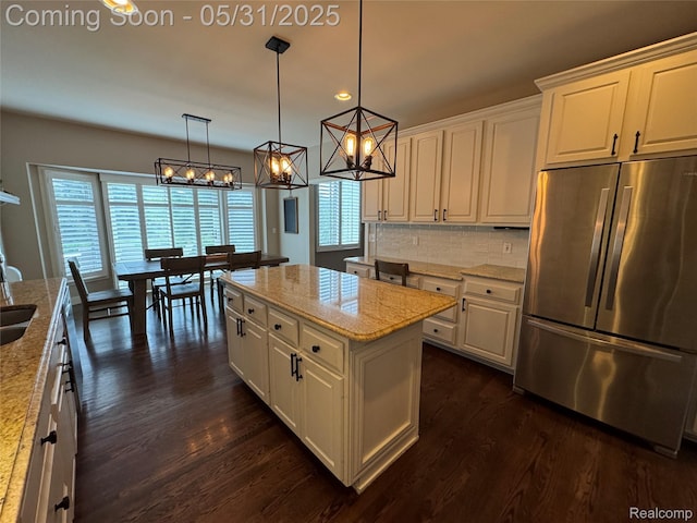 7348 William Dr, Shelby Twp, MI 48316 - kitchen with freestanding refrigerator, dark wood finished floors, white cabinetry, backsplash, and recessed lighting