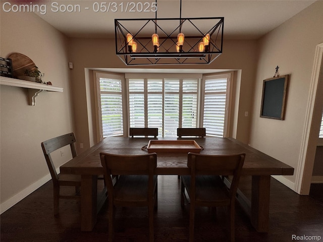 7348 William Dr, Shelby Twp, MI 48316 - dining space featuring a chandelier, baseboards, and wood finished floors