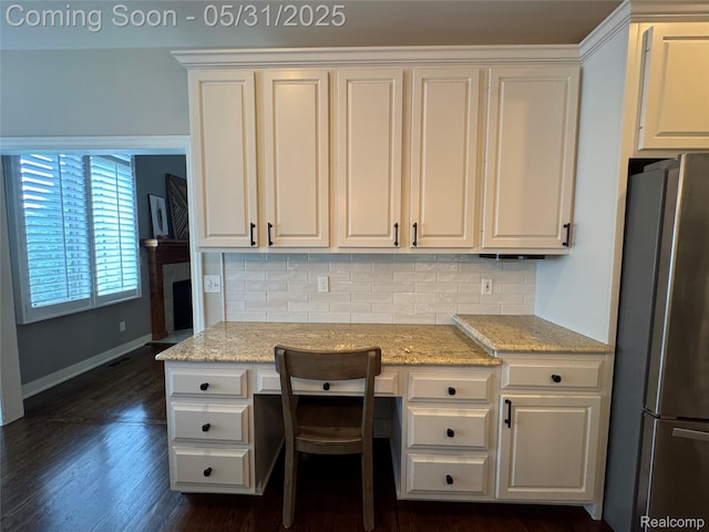 7348 William Dr, Shelby Twp, MI 48316 - kitchen featuring freestanding refrigerator, white cabinets, decorative backsplash, and baseboards