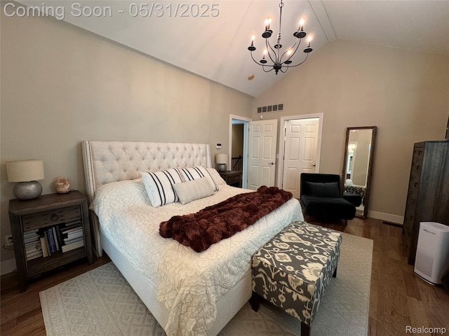7348 William Dr, Shelby Twp, MI 48316 - bedroom with a chandelier, wood finished floors, baseboards, and high vaulted ceiling
