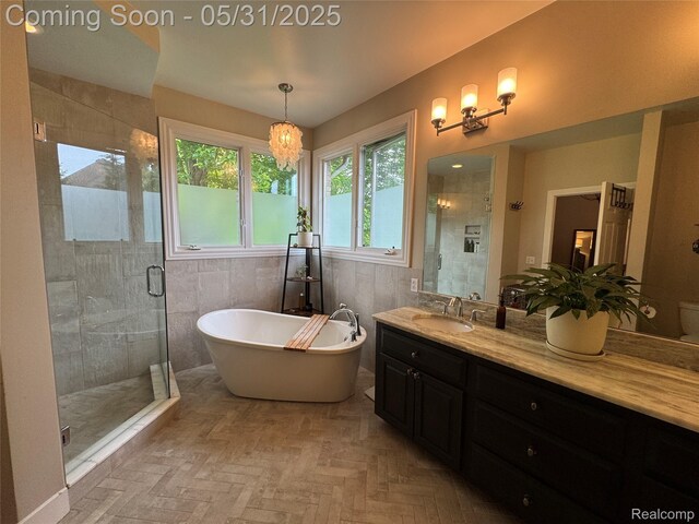 7348 William Dr, Shelby Twp, MI 48316 - full bathroom with a shower stall, a freestanding tub, and vanity