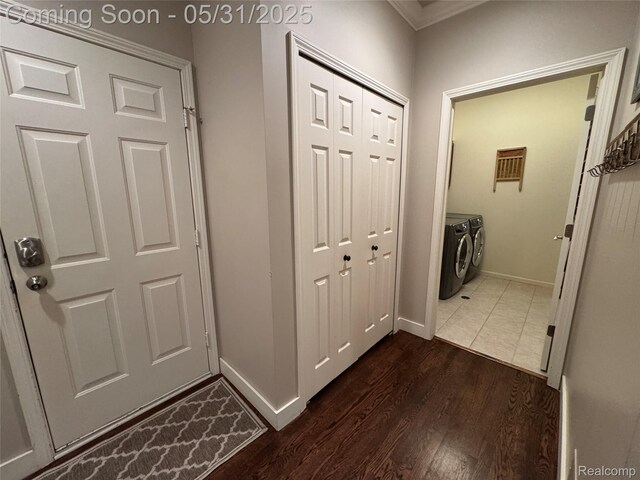 7348 William Dr, Shelby Twp, MI 48316 - corridor featuring separate washer and dryer, dark wood-style floors, baseboards, and crown molding