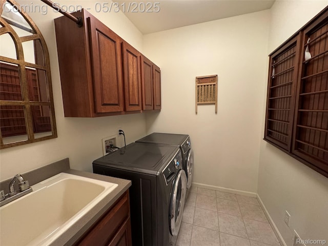 7348 William Dr, Shelby Twp, MI 48316 - laundry room with cabinet space, separate washer and dryer, light tile patterned floors, and baseboards