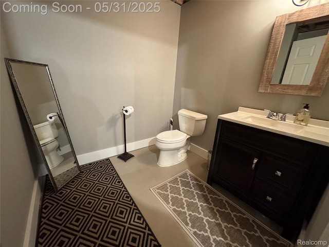 7348 William Dr, Shelby Twp, MI 48316 - bathroom with toilet, vanity, and baseboards