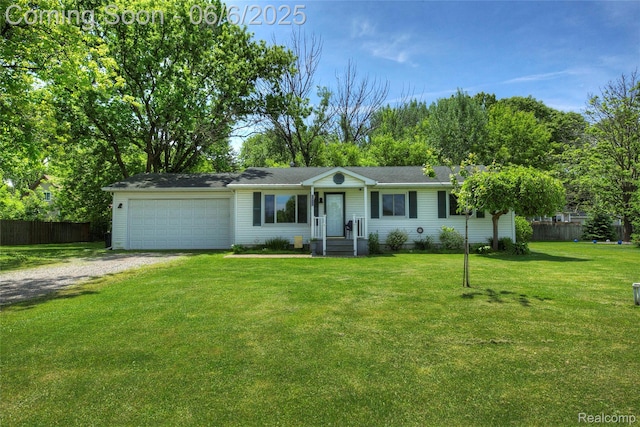 2470 E Highland Rd, Howell, MI 48843 - ranch-style home featuring driveway and an attached garage