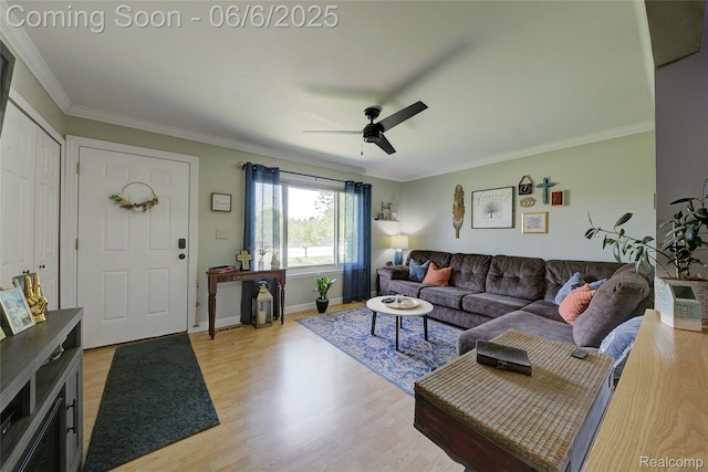 2470 E Highland Rd, Howell, MI 48843 - living room featuring a ceiling fan, light wood finished floors, crown molding, and baseboards