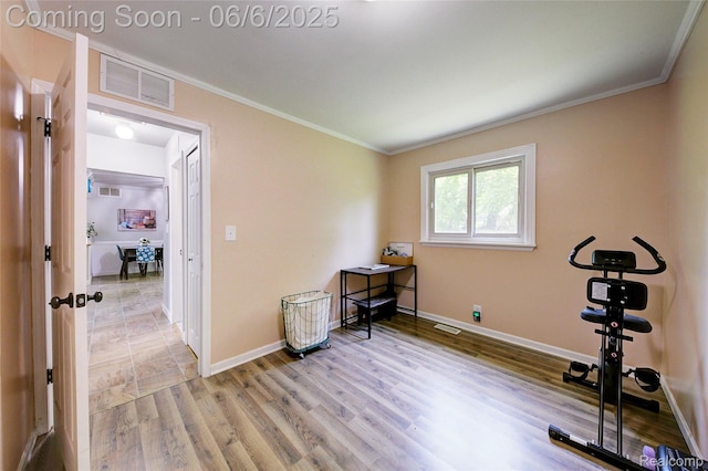 2470 E Highland Rd, Howell, MI 48843 - exercise area featuring ornamental molding, baseboards, and light wood finished floors