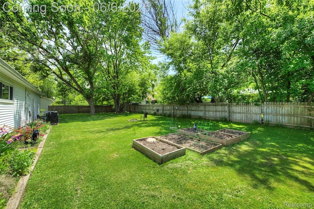 2470 E Highland Rd, Howell, MI 48843 - view of yard featuring a vegetable garden