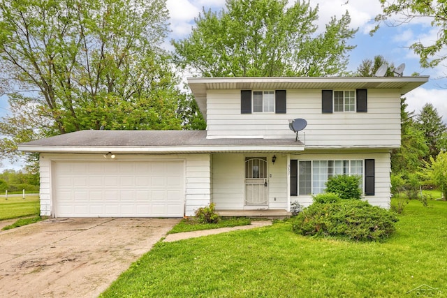 3637 Cora St, Saginaw, MI 48601 - traditional home featuring a garage, driveway, and a front yard