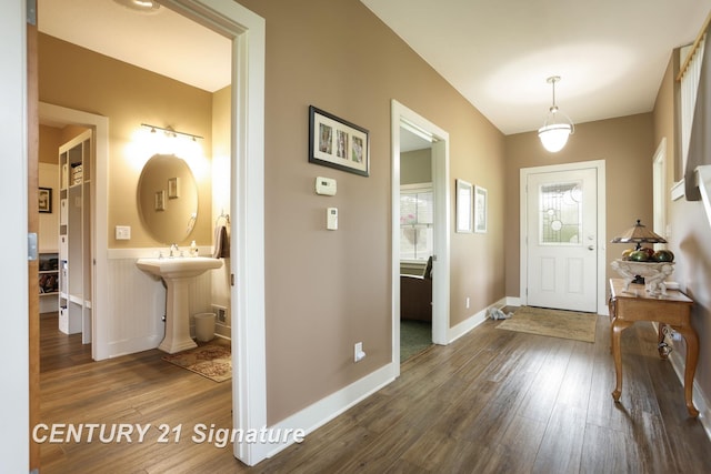 12751 Wilkinson Rd, Freeland, MI 48623 - entryway featuring wood finished floors, baseboards, and wainscoting