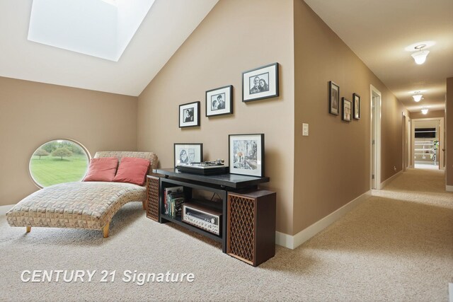 12751 Wilkinson Rd, Freeland, MI 48623 - living area featuring carpet, a skylight, baseboards, and vaulted ceiling