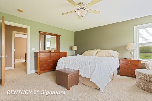 12751 Wilkinson Rd, Freeland, MI 48623 - carpeted bedroom with multiple windows, ceiling fan, and baseboards