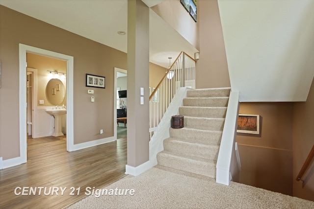 12751 Wilkinson Rd, Freeland, MI 48623 - staircase featuring wood finished floors and baseboards