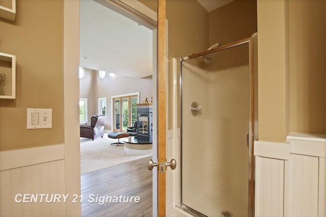 12751 Wilkinson Rd, Freeland, MI 48623 - bathroom featuring a shower stall, wood finished floors, and vaulted ceiling