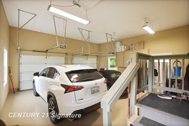 12751 Wilkinson Rd, Freeland, MI 48623 - garage featuring a garage door opener